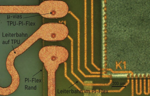 Abb. 3: Blindvias vom TPU-Substrat zum PI-Flex. Rechts im Bild der Testchip mit DC-Strukturen